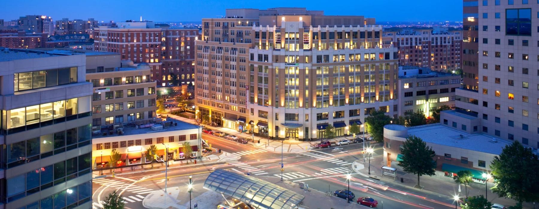 a city street with buildings and cars