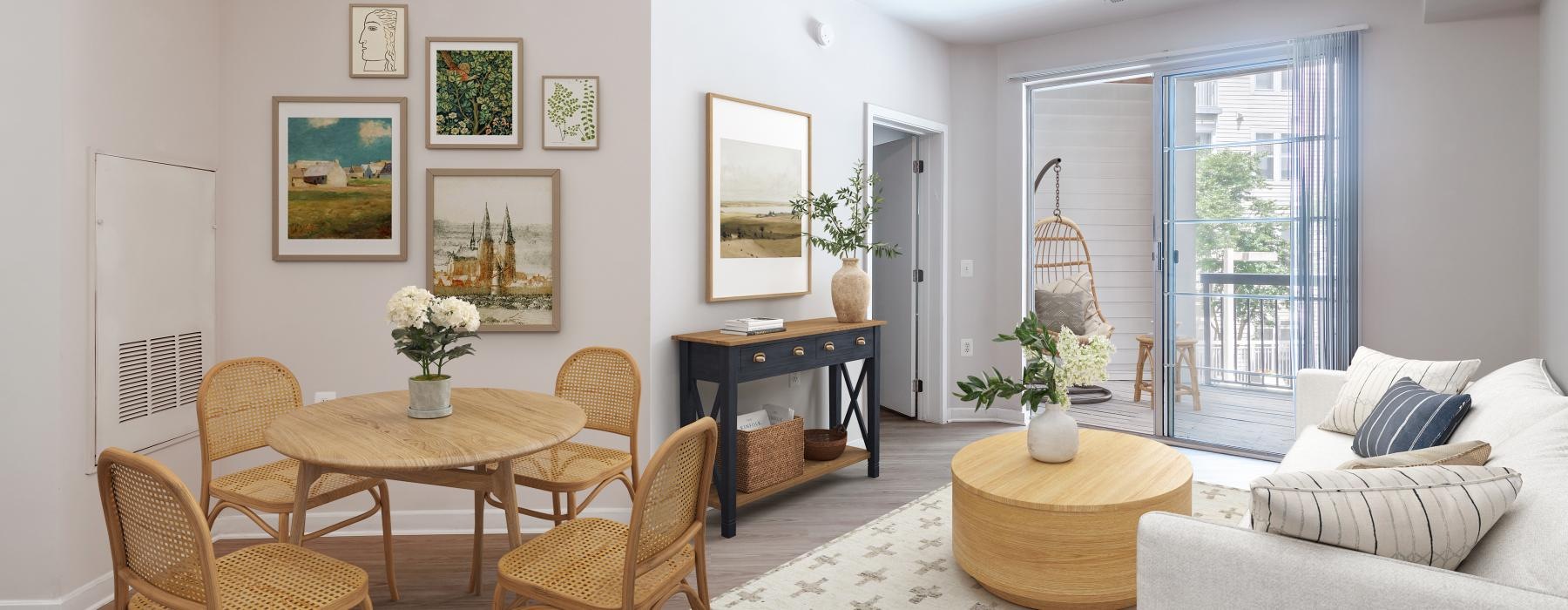 a living room with a table and chairs