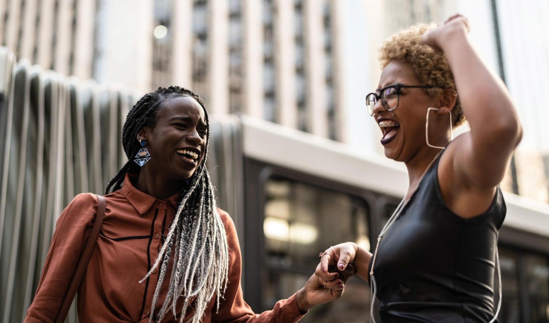A beautiful community at the heart of all your passions women laughing together in the city