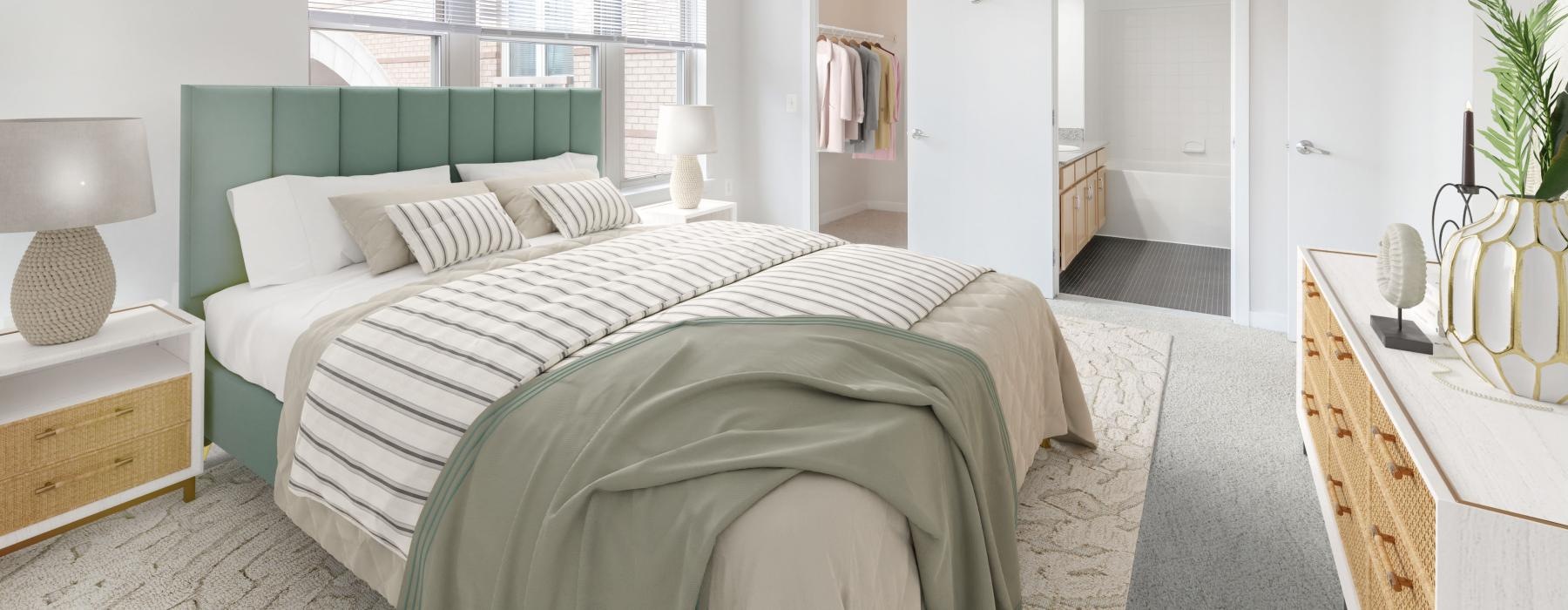 a bedroom with a bed and a closet and a large window